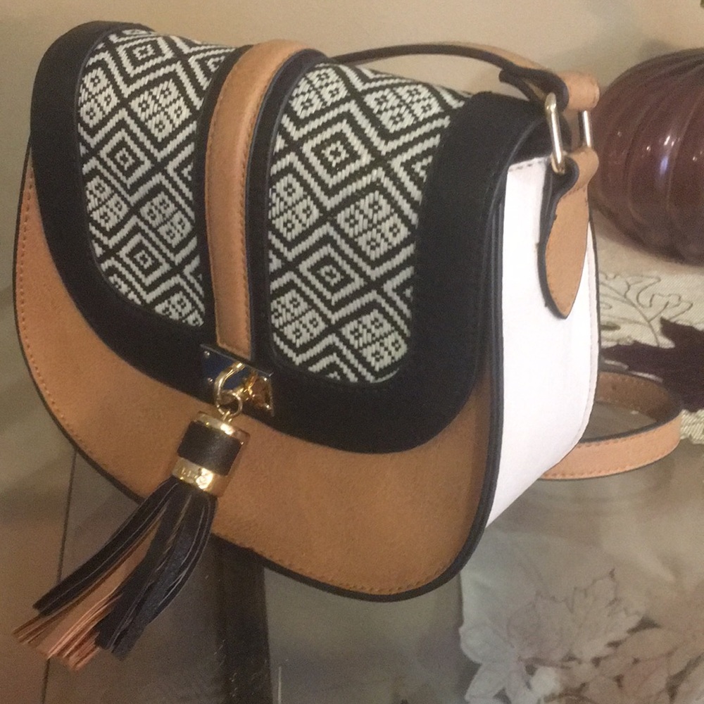 Aldo crossbody saddle purse with tassel